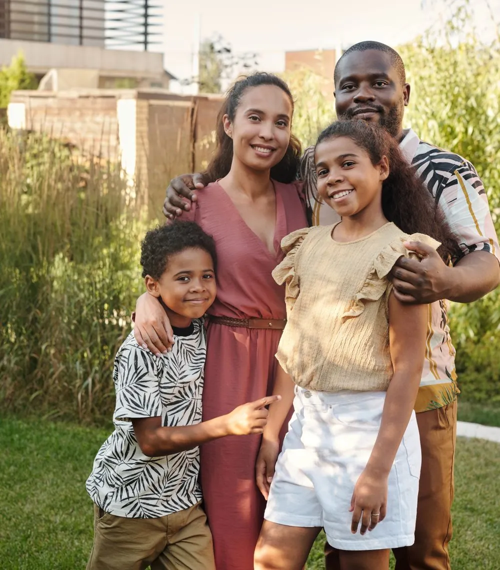 Happy family smiling together outdoors